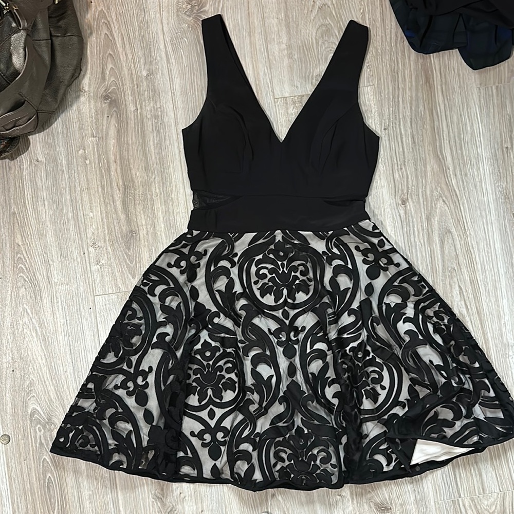 A vneck dress with peek-a-boo sides. A-line